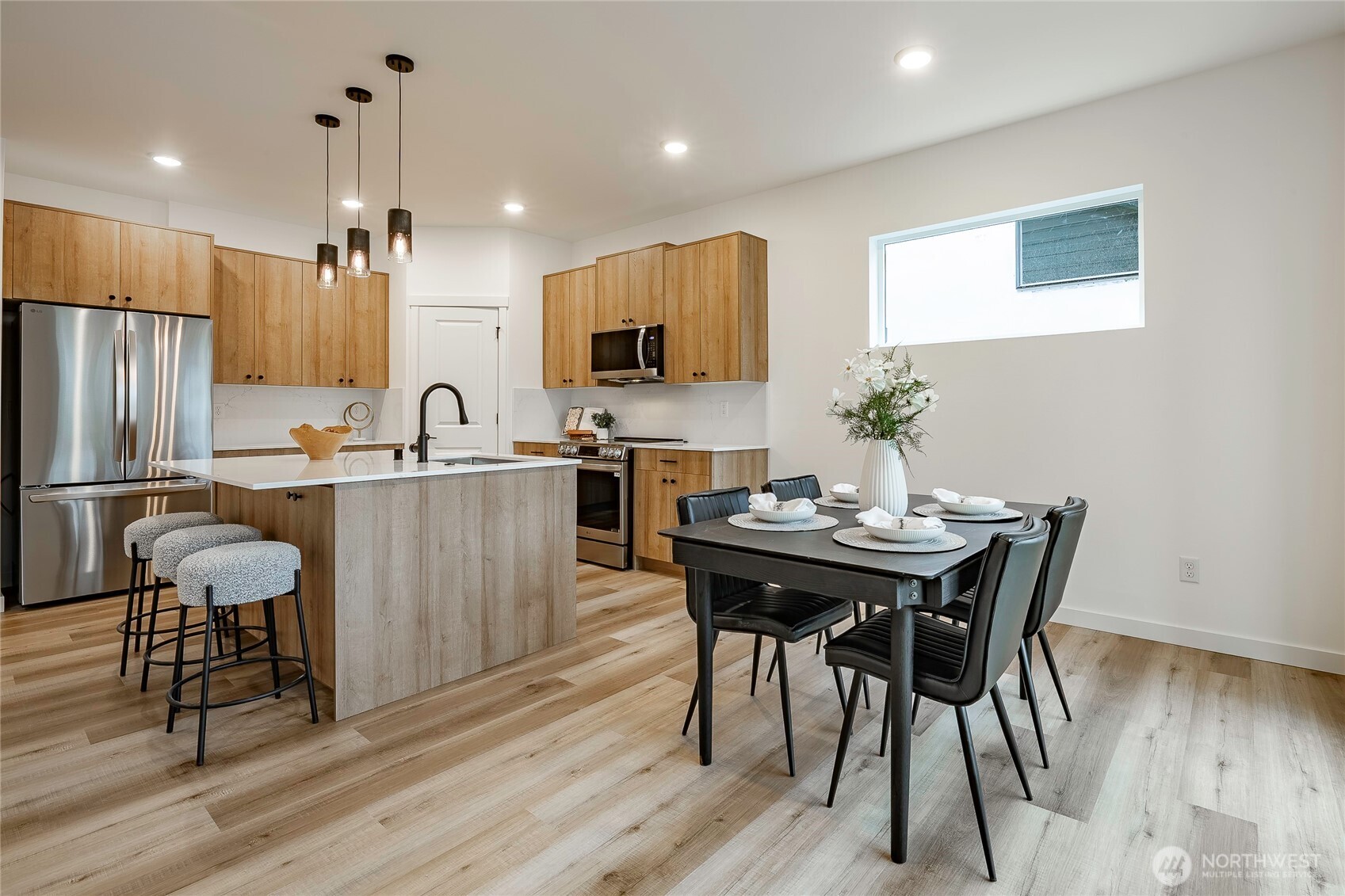 2999 Cedar View Road Blaine, WA 98230 - Photo 7 of 37 a kitchen with kitchen island a dining table and chairs