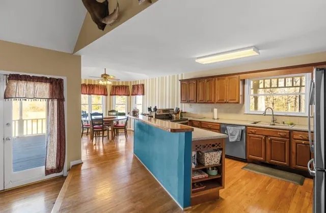 a kitchen with lots of counter top space and dining table