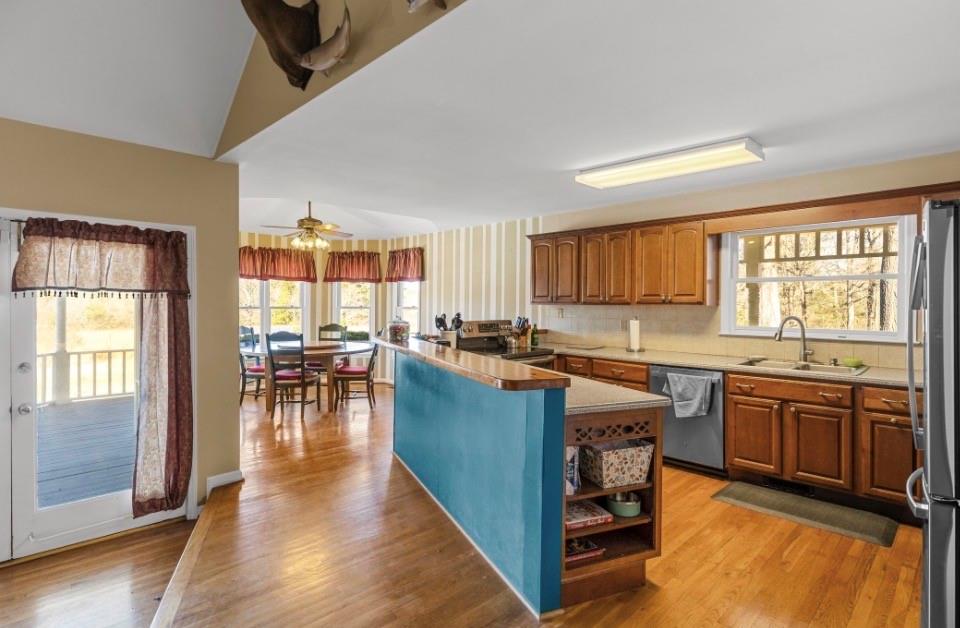 1776 Wax Road Silver Creek, GA 30173 - Photo 16 of 48 a kitchen with lots of counter top space and dining table