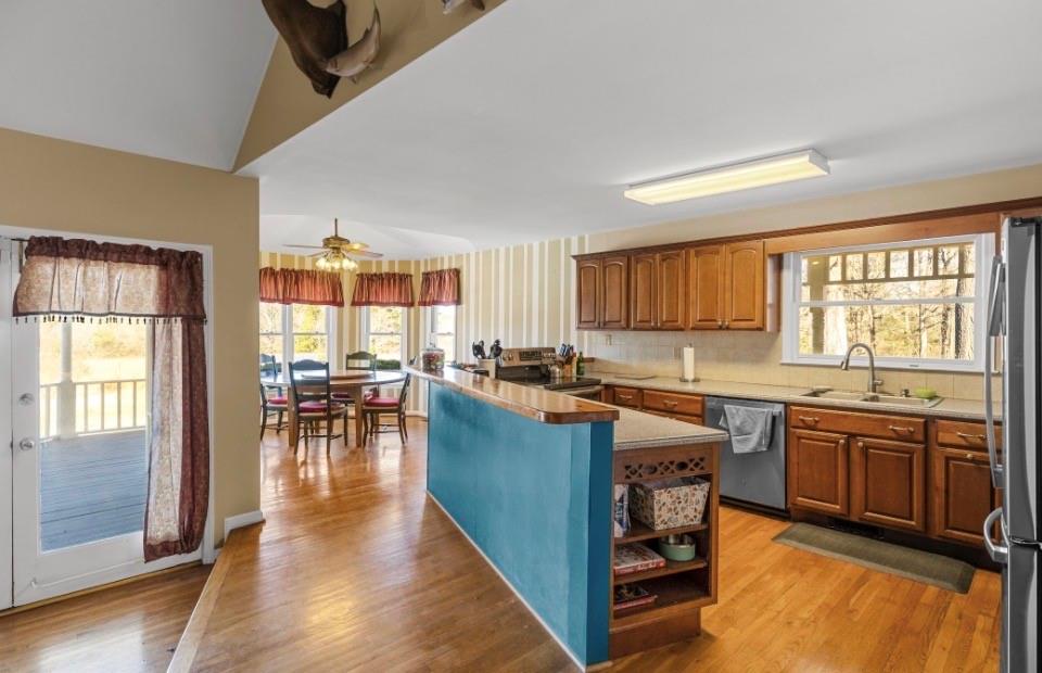1776 Wax Road Silver Creek, GA 30173 - Photo 17 of 48 a kitchen with lots of counter top space and dining table