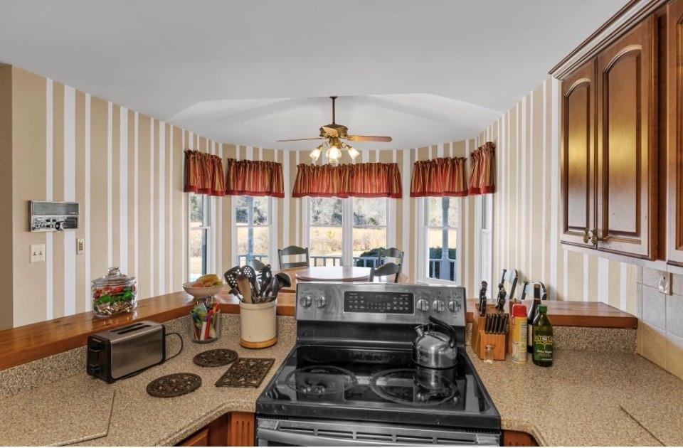 1776 Wax Road Silver Creek, GA 30173 - Photo 20 of 48 a living room with furniture and a chandelier