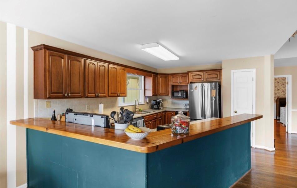 1776 Wax Road Silver Creek, GA 30173 - Photo 22 of 48 a room with stainless steel appliances kitchen island granite countertop a sink refrigerator and cabinets