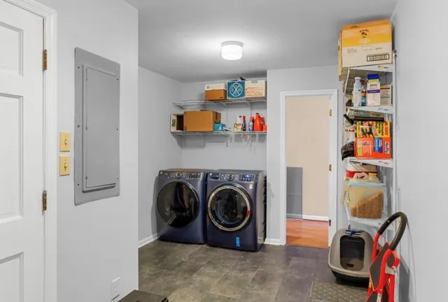 an empty room with windows and closet
