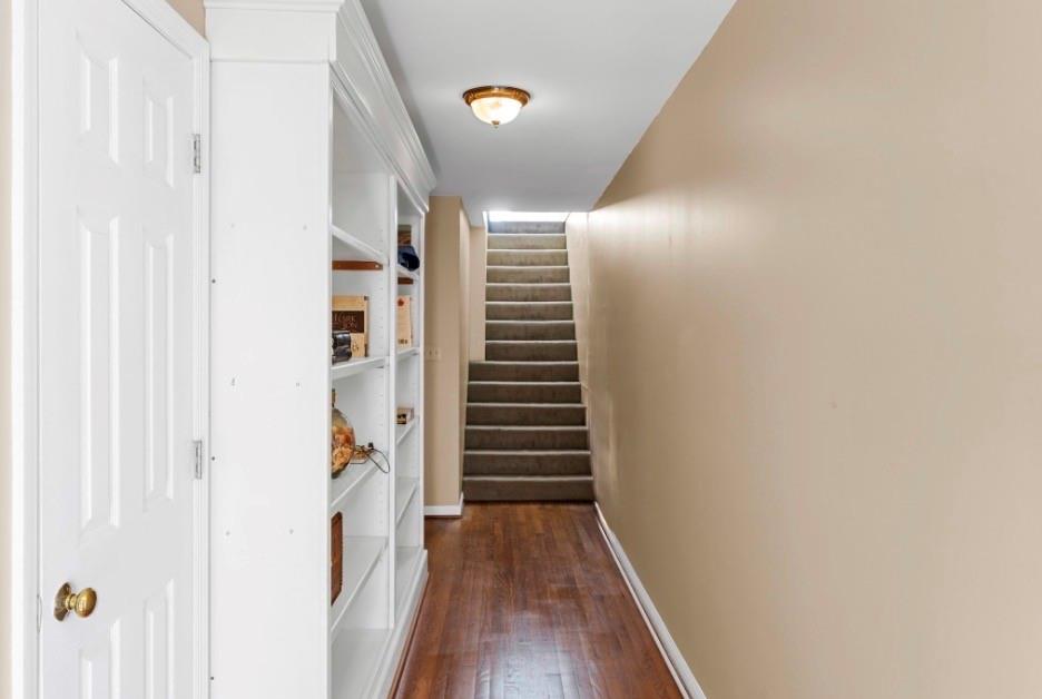1776 Wax Road Silver Creek, GA 30173 - Photo 29 of 48 a view of a hallway with wooden floor and stairs