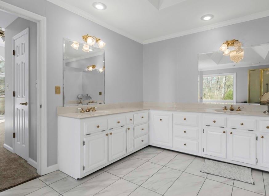 1776 Wax Road Silver Creek, GA 30173 - Photo 35 of 48 a spacious bathroom with double sink large mirror and a window