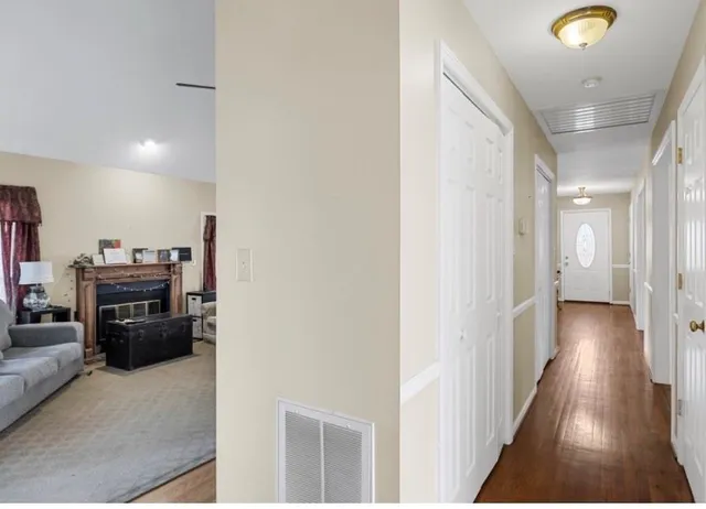 a bedroom with bed and a large window