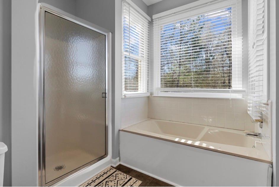 1776 Wax Road Silver Creek, GA 30173 - Photo 47 of 48 a bathroom with bathtub and shower