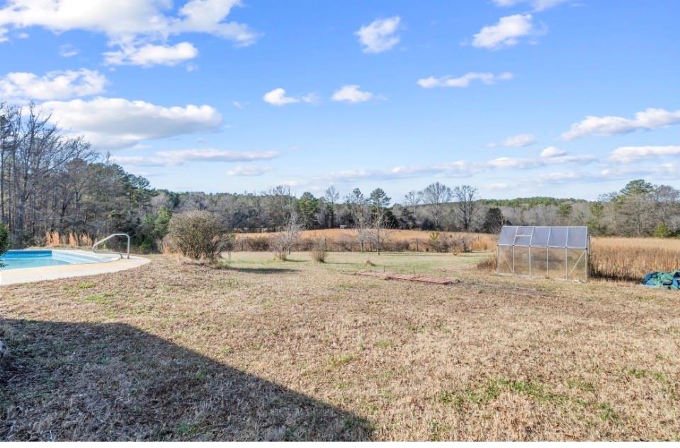 1776 Wax Road Silver Creek, GA 30173 - Photo 9 of 48 a view of a dry yard with trees