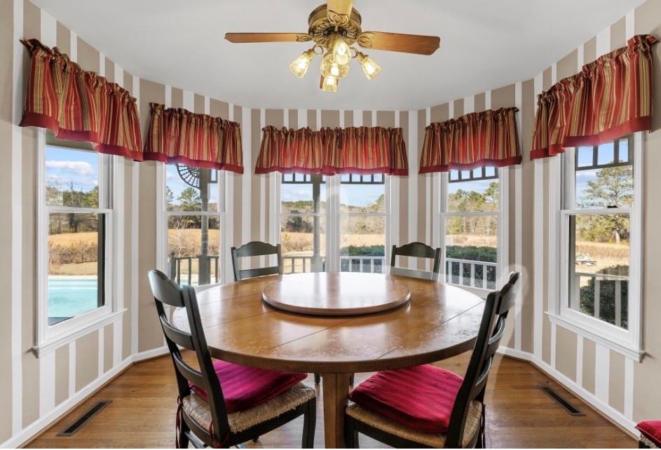 1776 Wax Road Silver Creek, GA 30173 - Photo 10 of 48 a dining room with furniture a chandelier and window