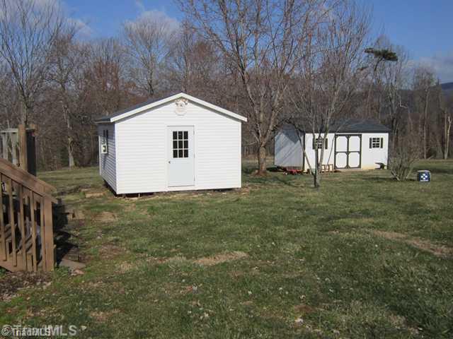 913 Traphill Union Road Traphill, NC 28685 - Photo 3 of 16 Outbuilding. Home office finished building with heat and storage building.