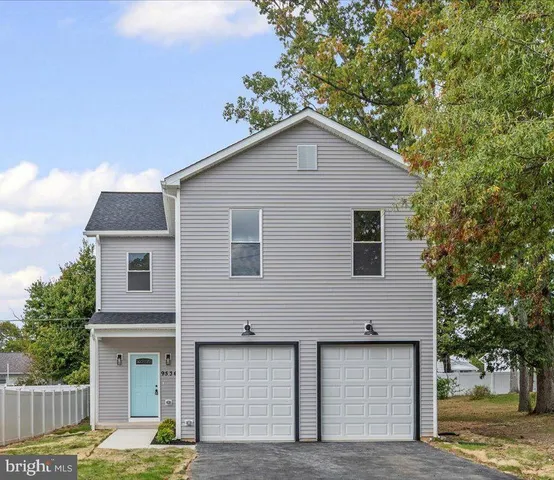 a house that has a tree in front of the house