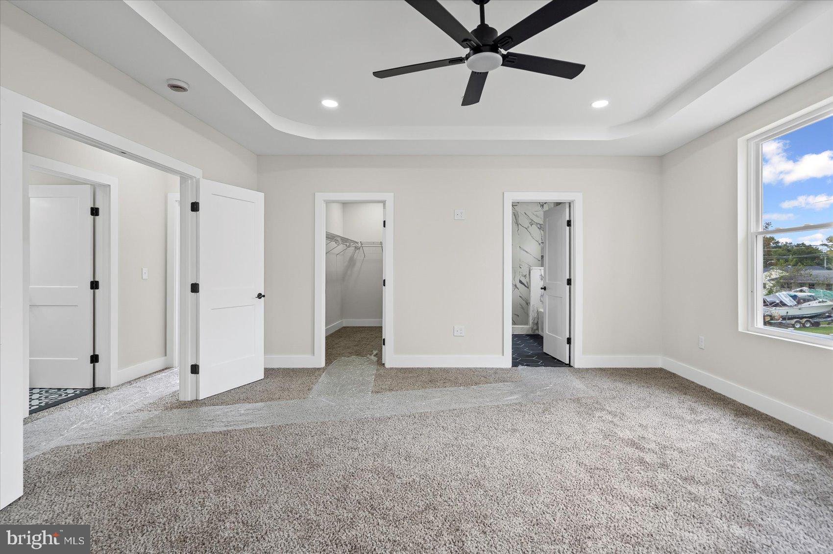 9534 Bauer Avenue Baltimore, MD 21236 - Photo 20 of 53 an empty room with fan and windows