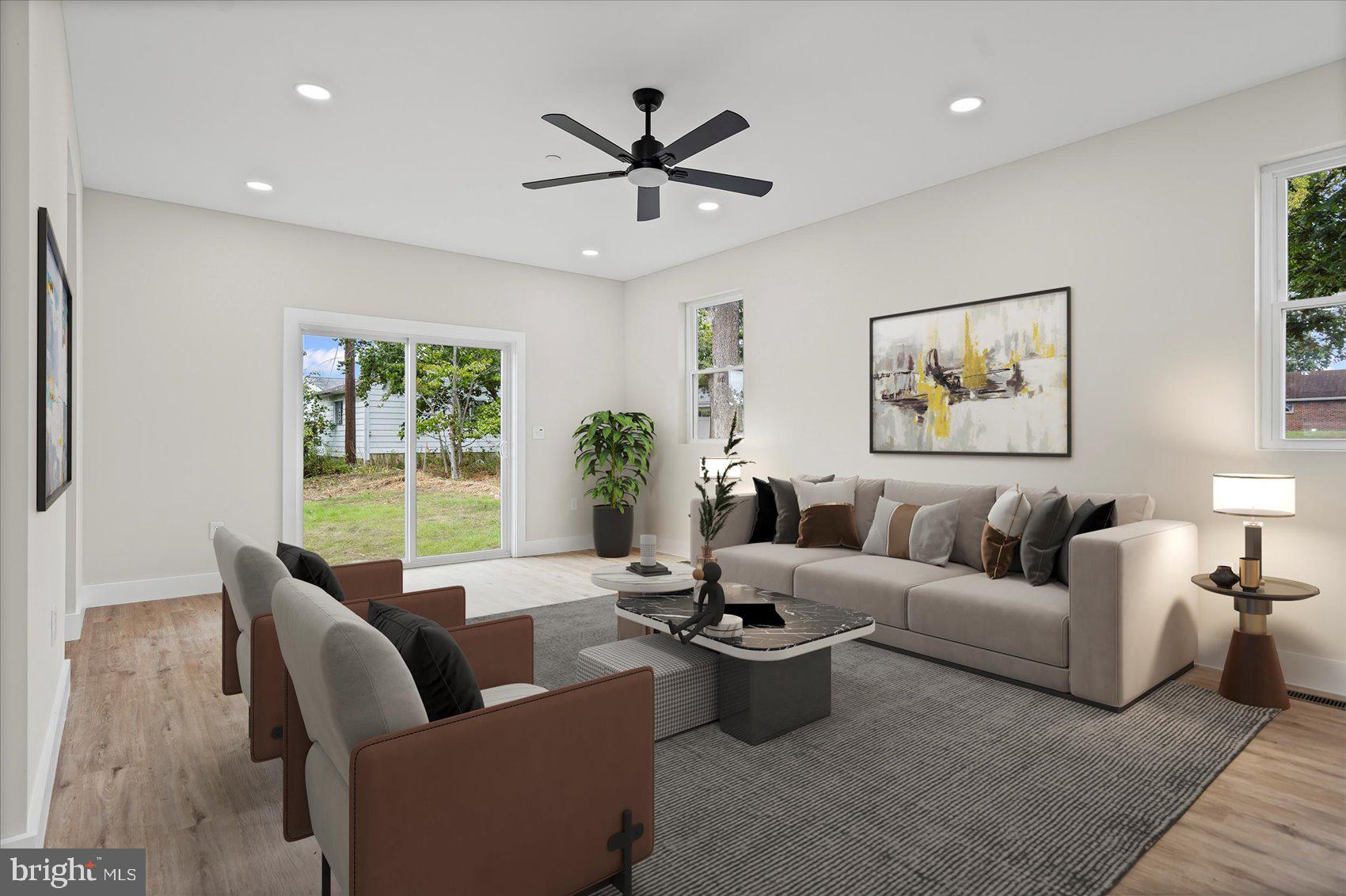 9534 Bauer Avenue Baltimore, MD 21236 - Photo 2 of 53 a living room with furniture a chandelier and a large window