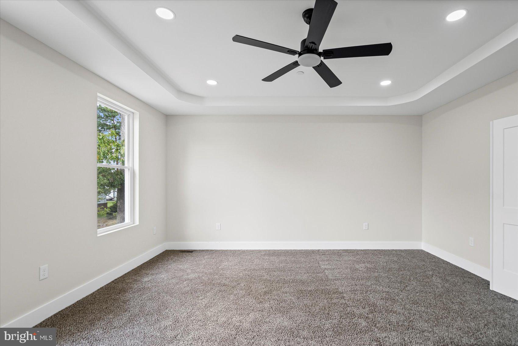 9534 Bauer Avenue Baltimore, MD 21236 - Photo 21 of 53 a view of a livingroom with a ceiling fan & windows
