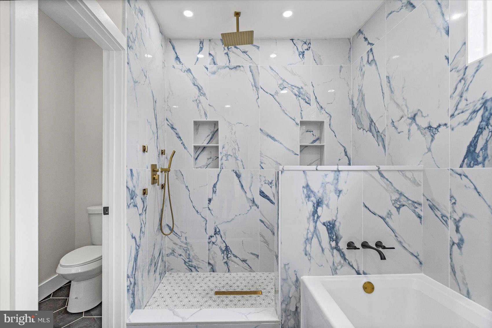 9534 Bauer Avenue Baltimore, MD 21236 - Photo 23 of 53 a bathroom with a toilet sink and shower