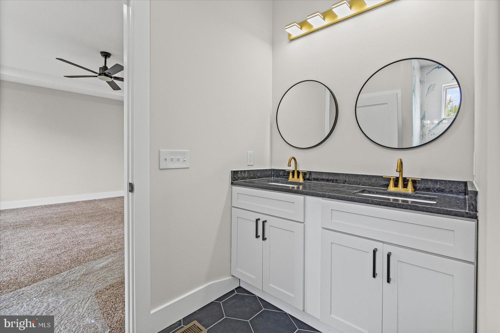 9534 Bauer Avenue Baltimore, MD 21236 - Photo 26 of 53 a bathroom with a sink and a mirror