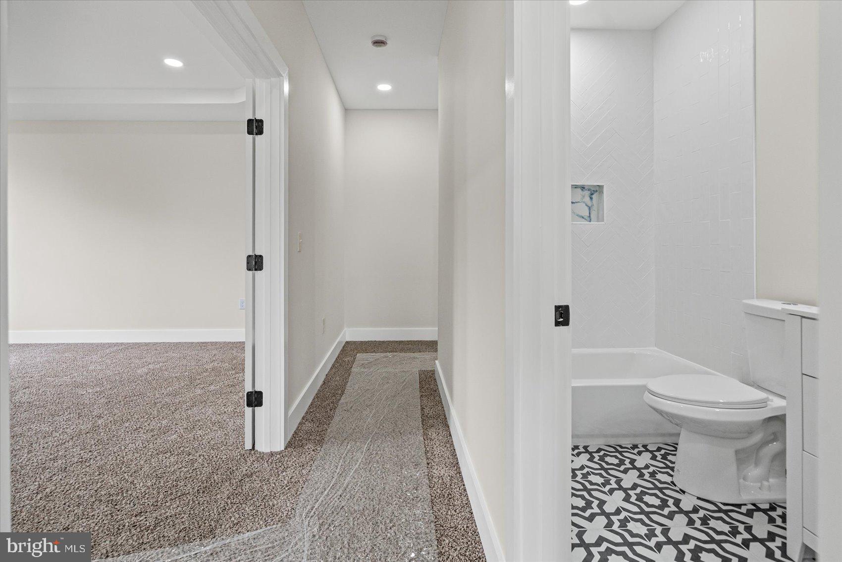 9534 Bauer Avenue Baltimore, MD 21236 - Photo 27 of 53 a bathroom with a sink and a toilet