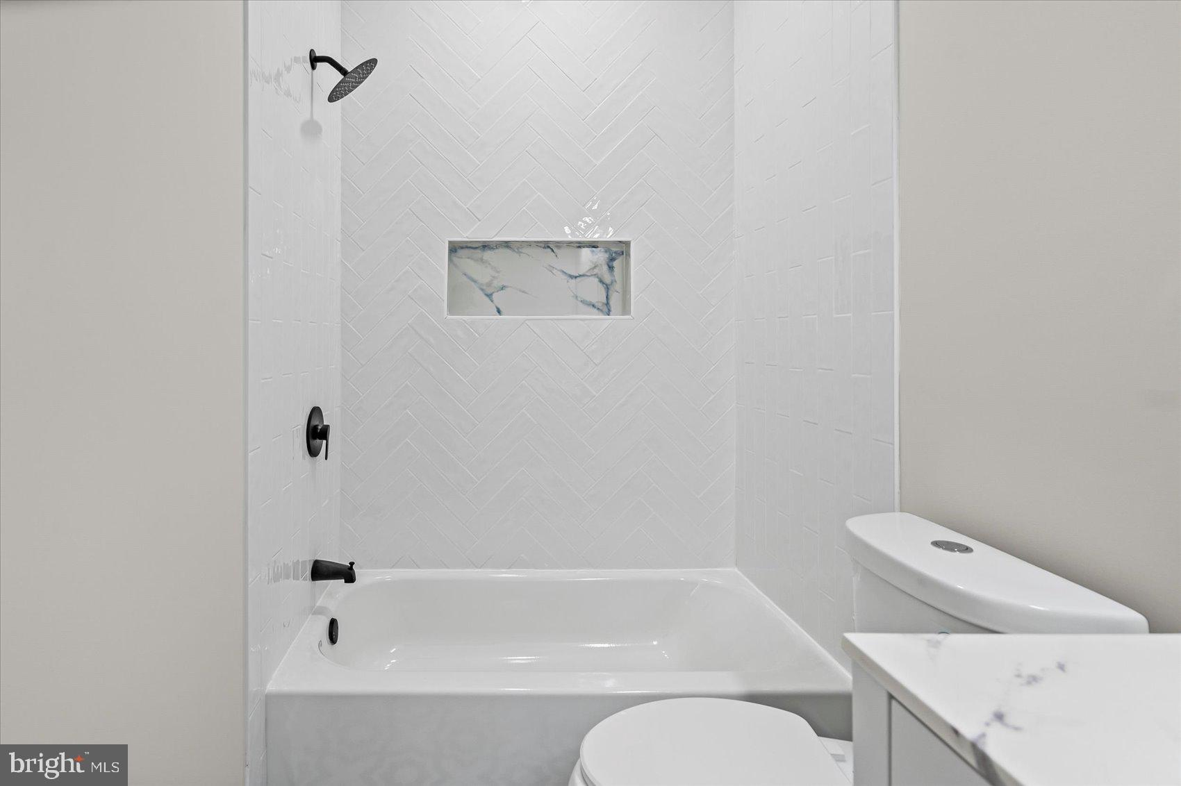 9534 Bauer Avenue Baltimore, MD 21236 - Photo 29 of 53 a bathroom with a bathtub and sink