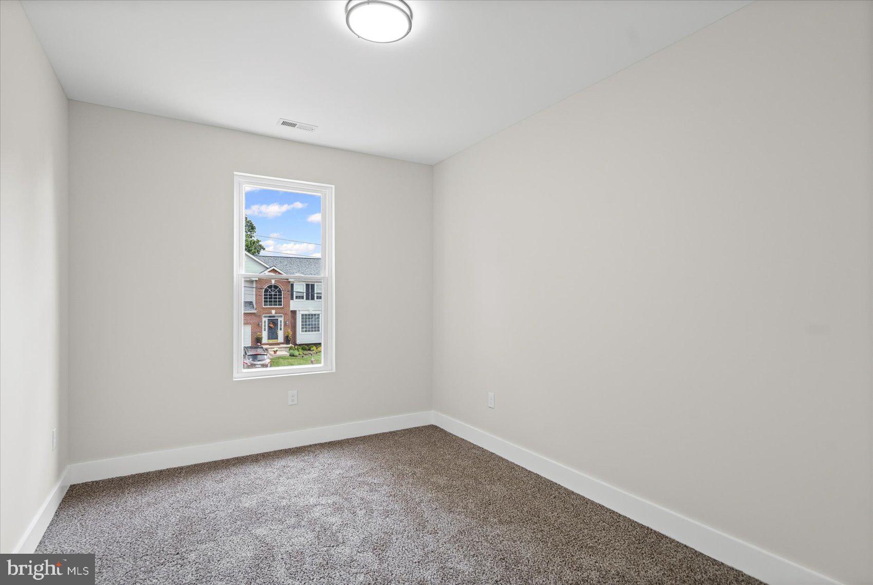 9534 Bauer Avenue Baltimore, MD 21236 - Photo 31 of 53 an empty room with windows