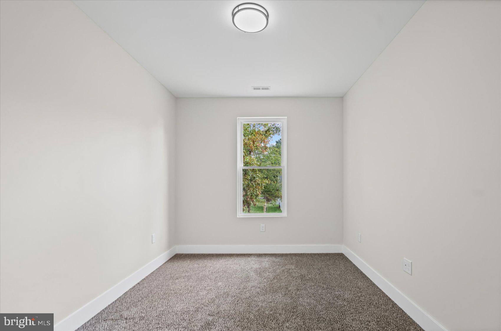9534 Bauer Avenue Baltimore, MD 21236 - Photo 33 of 53 an empty room with windows