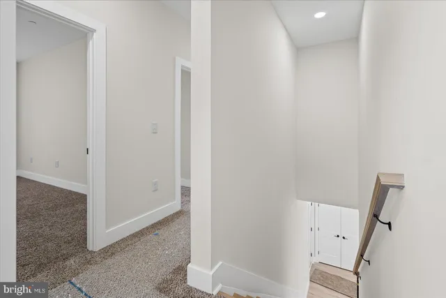 a view of a hallway with hallway and stairs