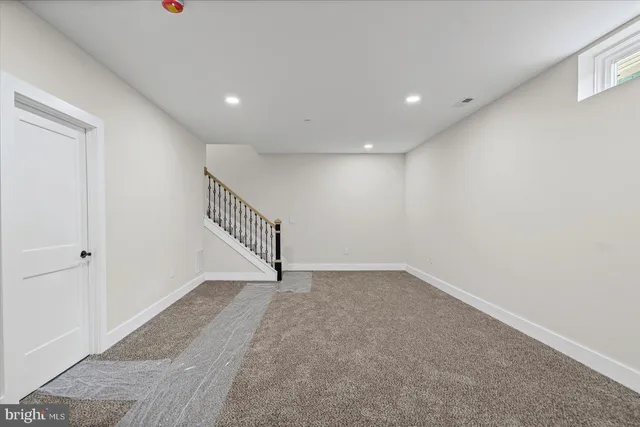 a view of an empty room with stairs