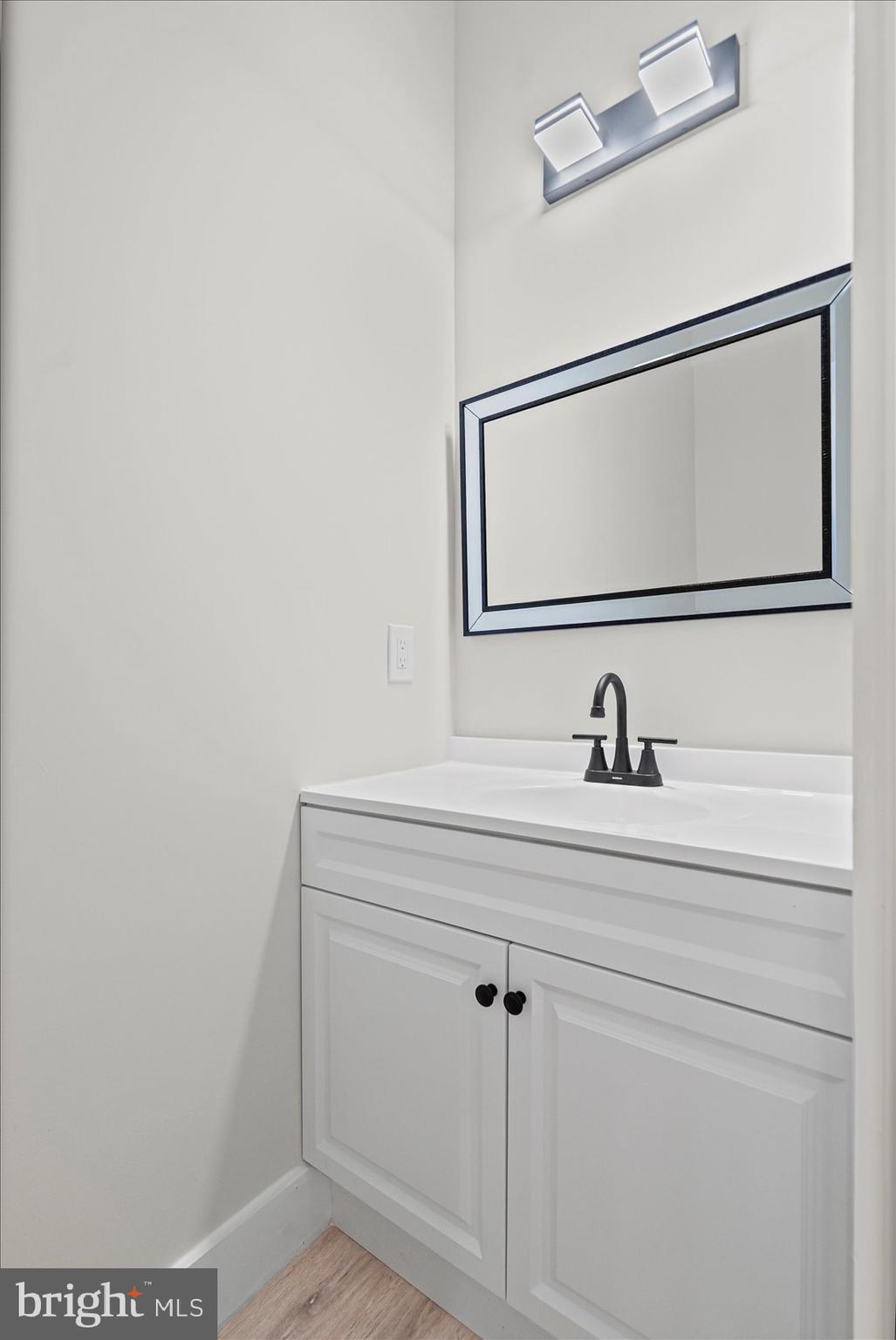 9534 Bauer Avenue Baltimore, MD 21236 - Photo 42 of 53 a bathroom with a sink and mirror