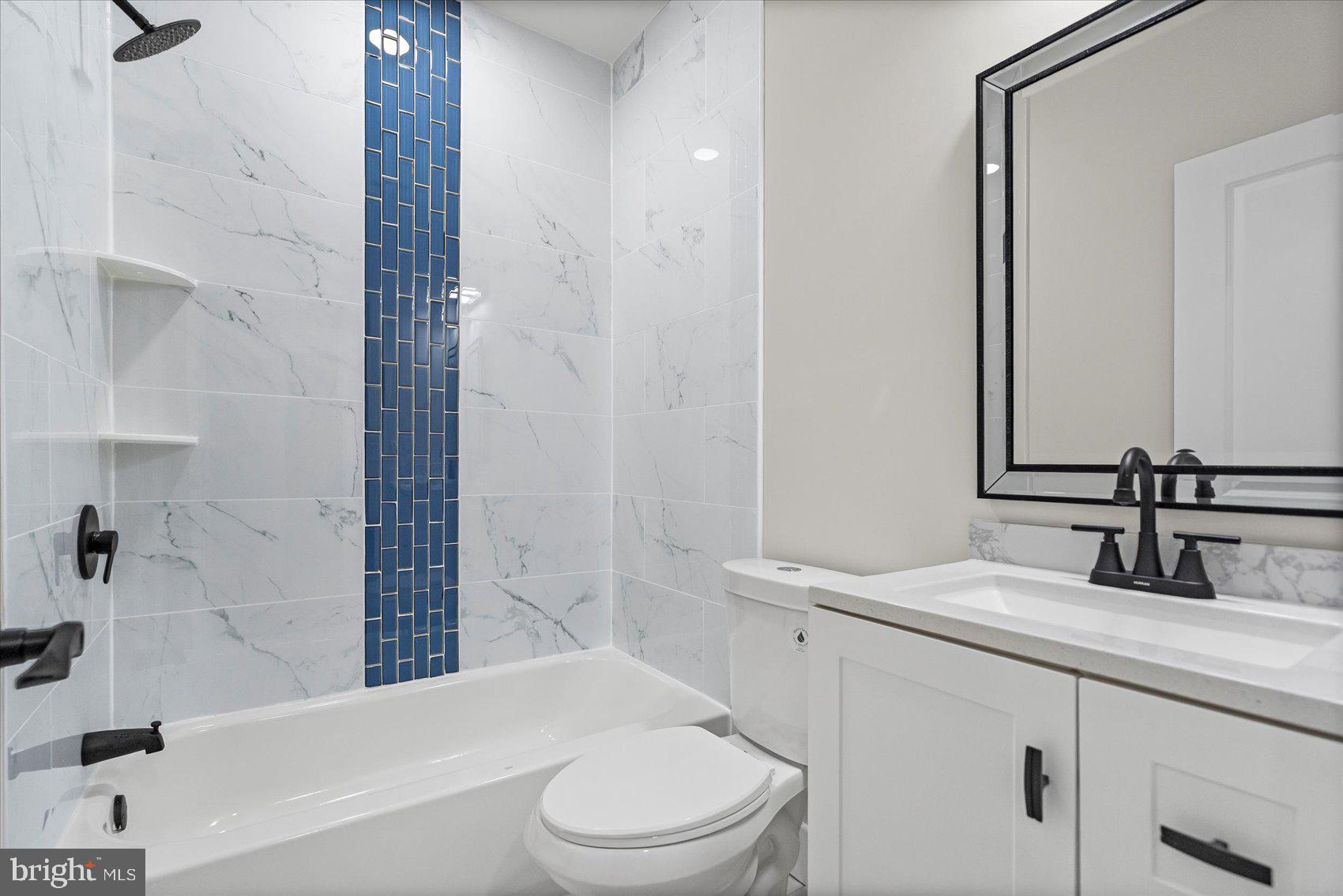 9534 Bauer Avenue Baltimore, MD 21236 - Photo 43 of 53 a bathroom with a sink a toilet and shower