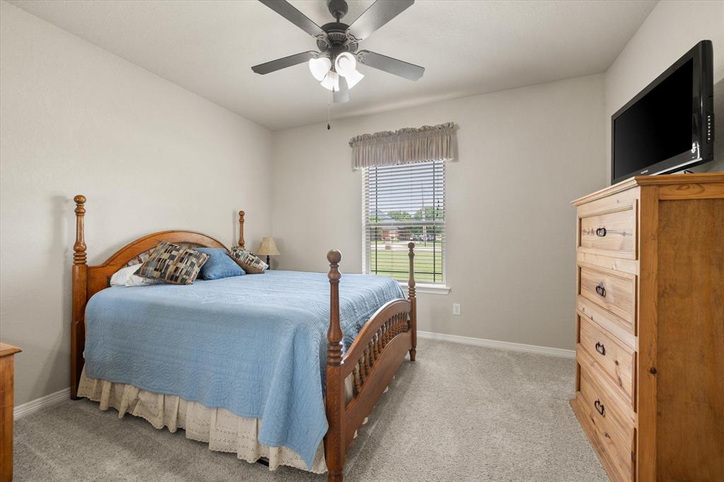 413 Rugged Drive Red Oak, TX 75154 - Photo 22 of 39 Second bedroom has a walk in closet and ceiling fan