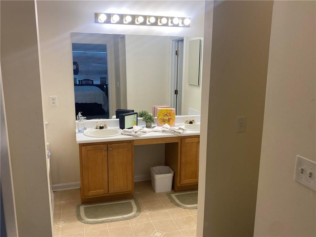 541 Cascade Hills Court Southwest Atlanta, GA 30331 - Photo 28 of 38 a bathroom with a sink and a mirror