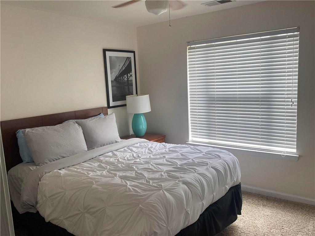 541 Cascade Hills Court Southwest Atlanta, GA 30331 - Photo 34 of 38 a bedroom with a bed and a window