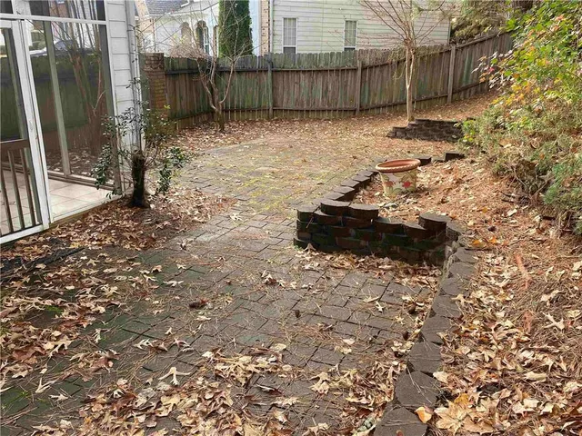 a view of a backyard of the house