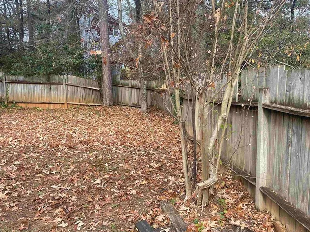 a backyard of a house with lots of green space