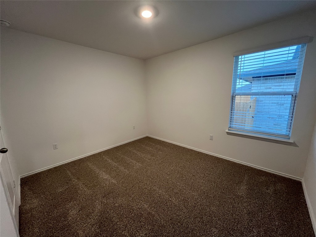 15016 B Welsh Cob Road, Unit B Manor, TX 78653 - Photo 11 of 14 an empty room with a window