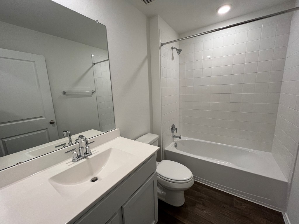 15016 B Welsh Cob Road, Unit B Manor, TX 78653 - Photo 12 of 14 a bathroom with a sink toilet and shower