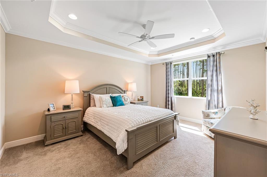 6969 Avalon Circle, Unit 1504 Naples, FL 34112 - Photo 18 of 42 a bedroom with a bed and window