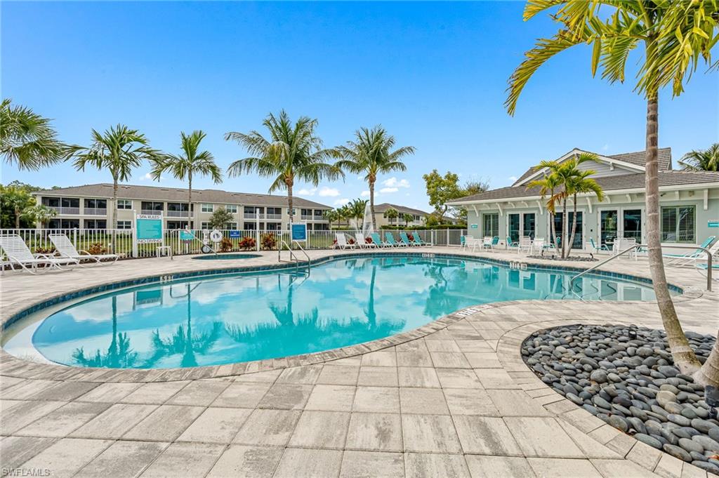 6969 Avalon Circle, Unit 1504 Naples, FL 34112 - Photo 36 of 42 a view of a swimming pool with a patio