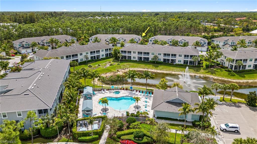 6969 Avalon Circle, Unit 1504 Naples, FL 34112 - Photo 39 of 42 an aerial view of a house with a garden and lake view