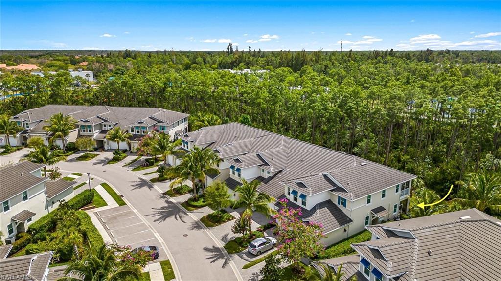 6969 Avalon Circle, Unit 1504 Naples, FL 34112 - Photo 42 of 42 an aerial view of a house with a yard
