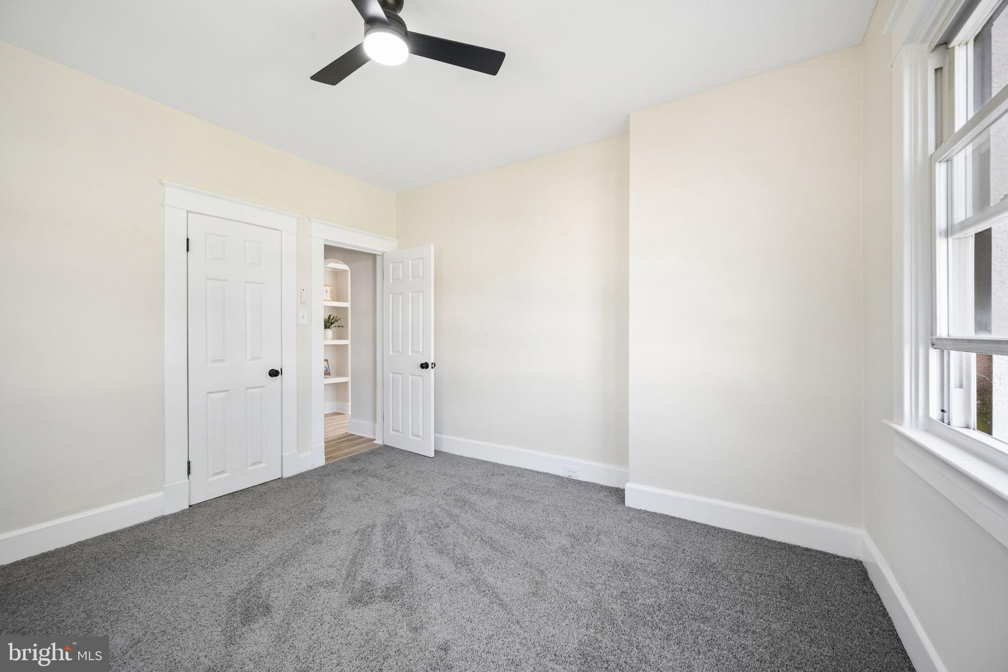 517 Valcour Road Baltimore, MD 21228 - Photo 4 of 47 an empty room with windows and fan