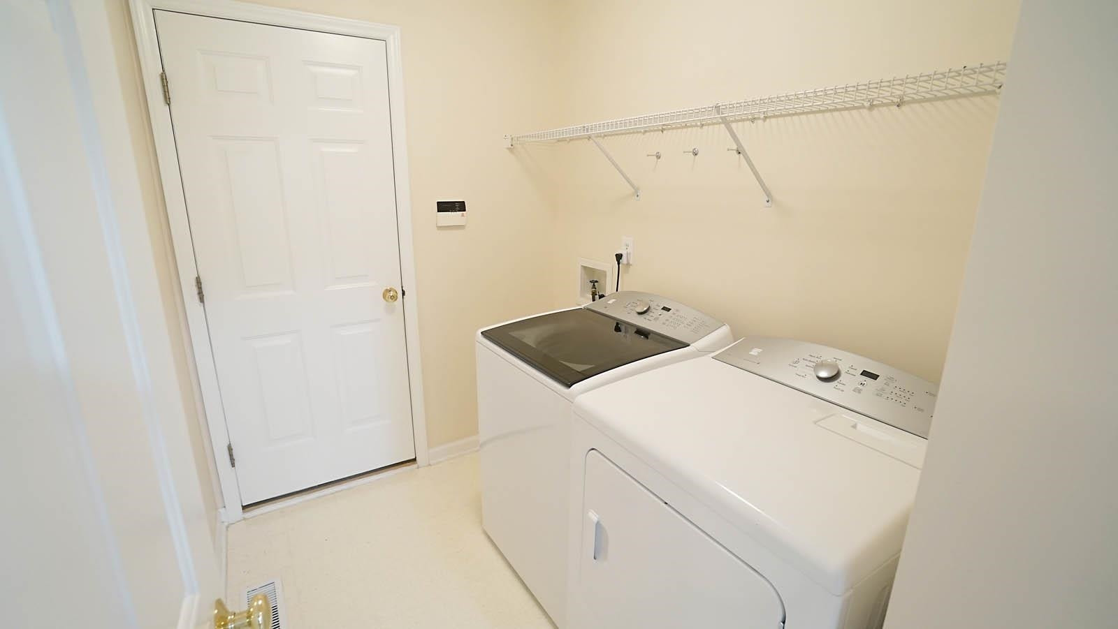 8316 Trumpetor Way Raleigh, NC 27613 - Photo 21 of 26 Laundry is in utility room at entry to garage. Utility Room