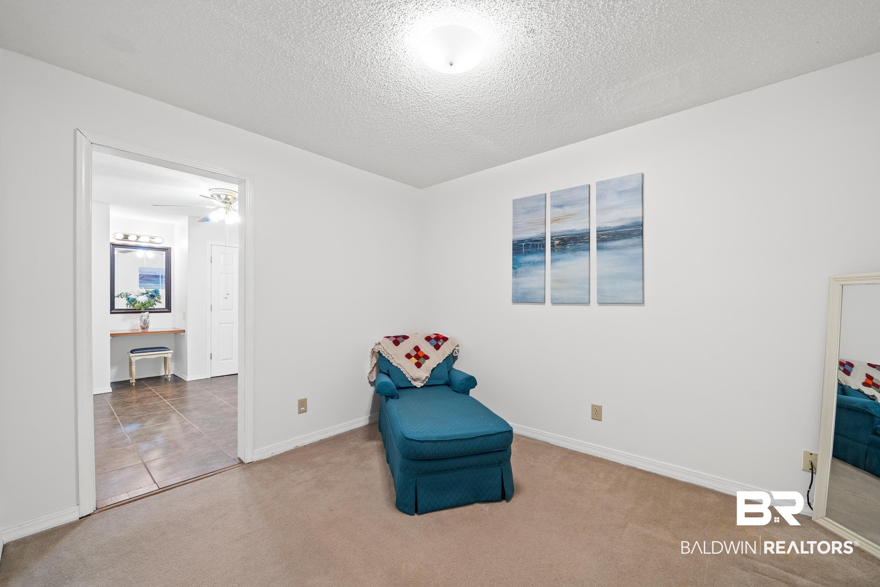 460 Ridgewood Drive Daphne, AL 36526 - Photo 9 of 31 Sitting room with ceiling fan, tile patterned floors, and a textured ceiling