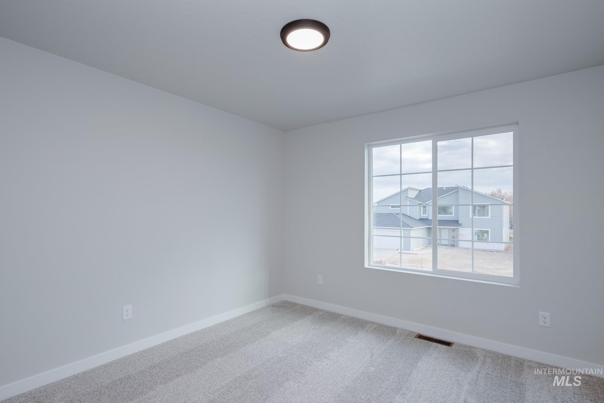 3089 South Maple Rnch Way Nampa, ID 83686 - Photo 17 of 22 Empty room featuring baseboards and carpet