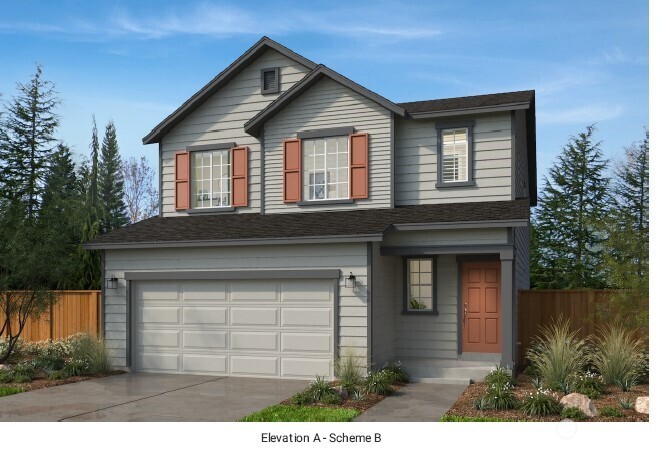 23962 35th Drive Southeast, Unit 36 Bothell, WA 98021 - Photo 1 of 3 a front view of a house with a garden