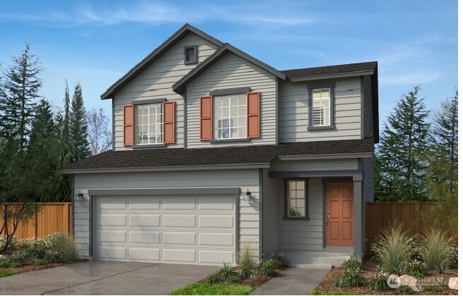 23962 35th Drive Southeast, Unit 36 Bothell, WA 98021 - Photo 1 of 3 a front view of a house with garden