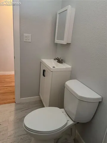 a bathroom with a toilet and a sink