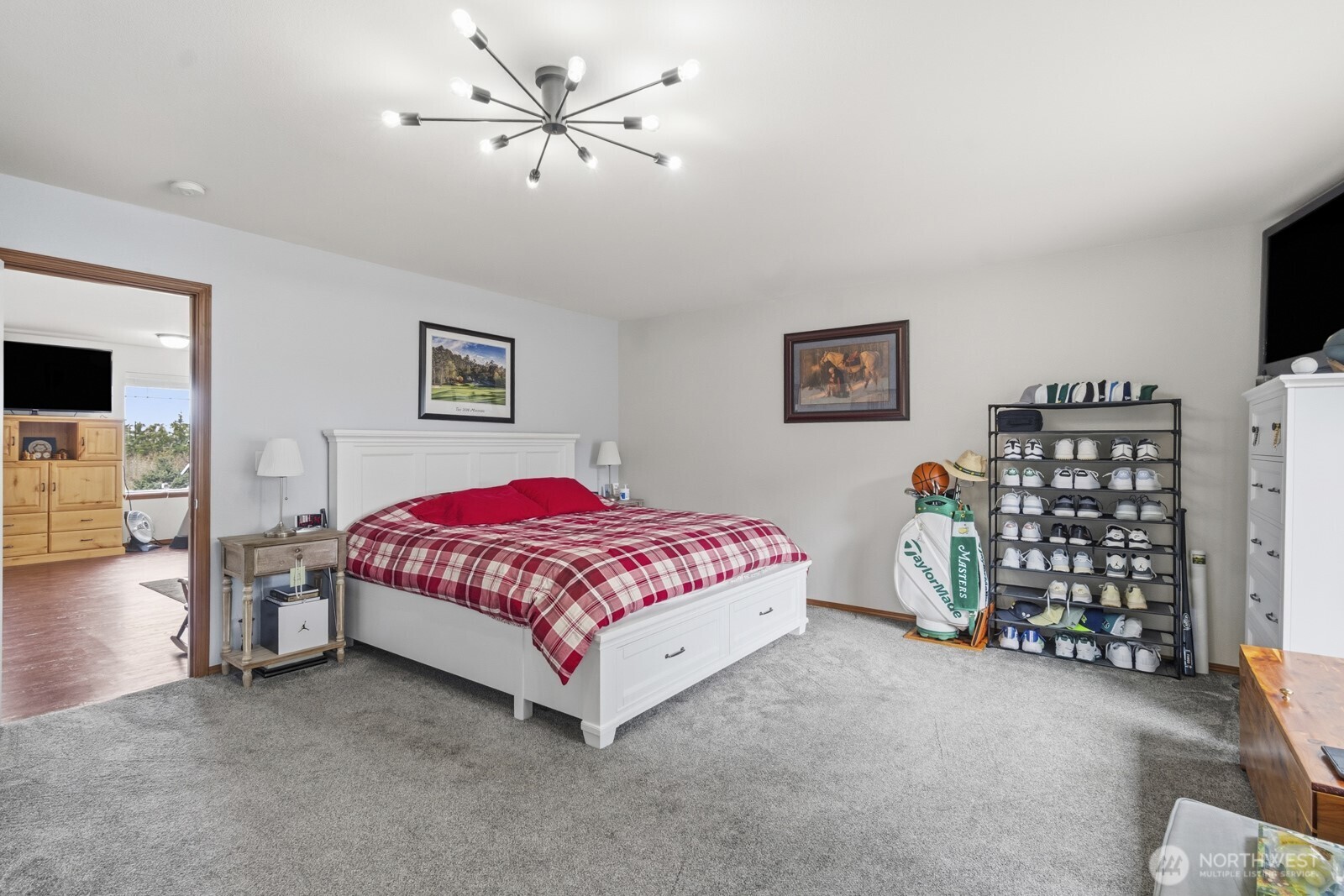 1804 Harborview Drive Aberdeen, WA 98520 - Photo 15 of 30 a bedroom with a bed and a chandelier