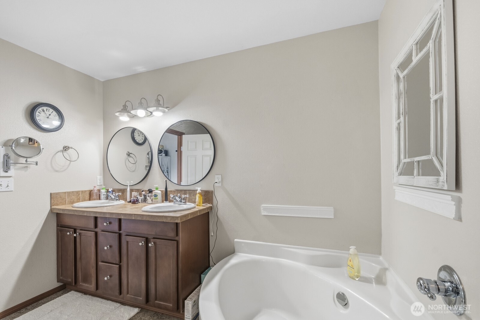 1804 Harborview Drive Aberdeen, WA 98520 - Photo 17 of 30 a bathroom with a toilet a sink and a mirror