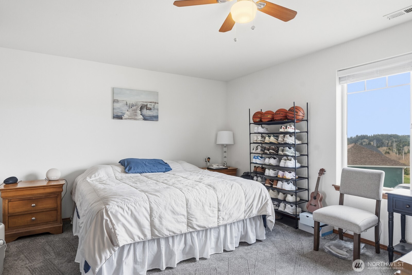 1804 Harborview Drive Aberdeen, WA 98520 - Photo 19 of 30 a bedroom with a bed and a bookshelf