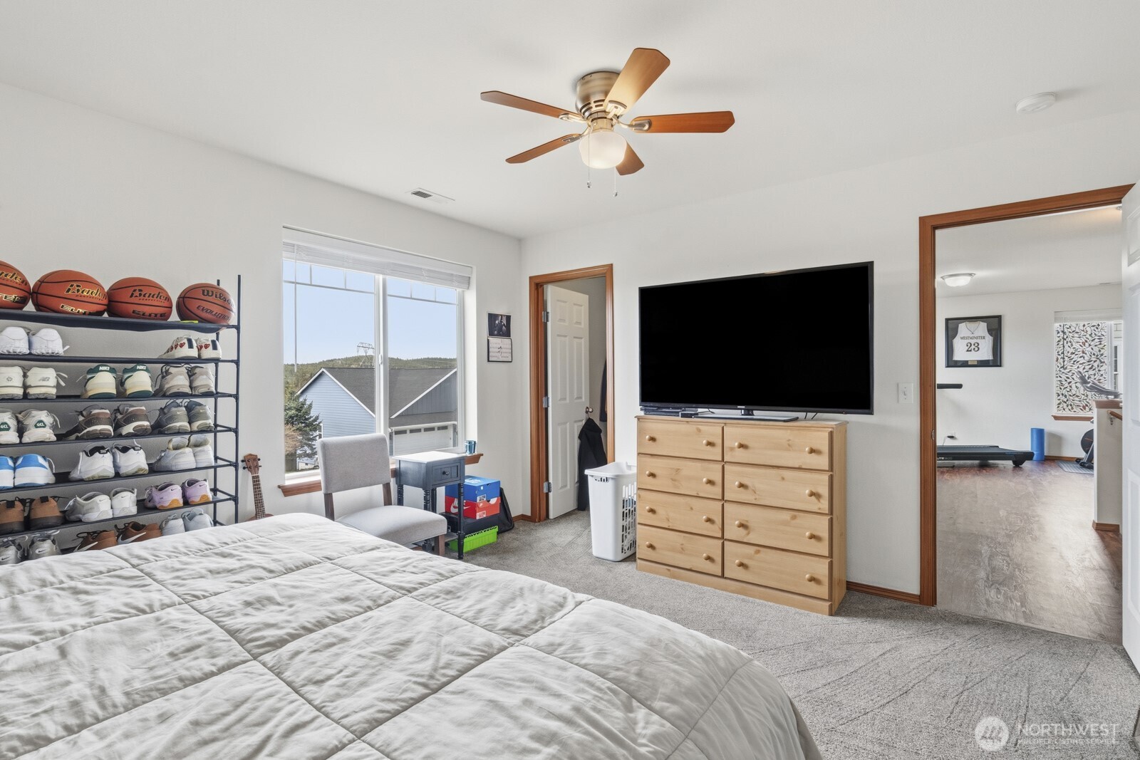 1804 Harborview Drive Aberdeen, WA 98520 - Photo 20 of 30 a bedroom with a bed and a flat tv screen on dresser